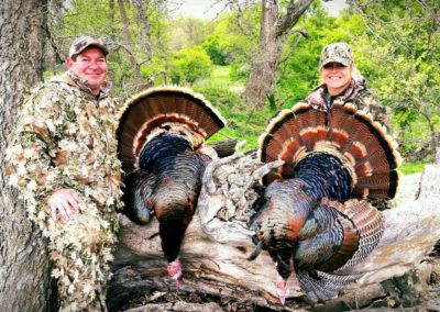 Husband and wife pair getting after Nebraska Turkey Hunts